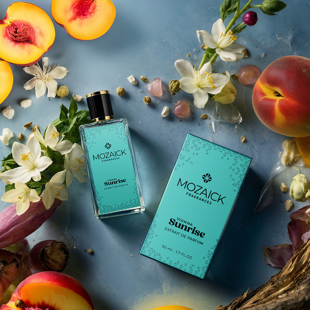 VIENNA SUNRISE Extrait de Parfum 50 ml by MOZAICK – bottle and box with apricots and white flowers on a blue surface